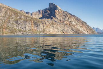 View of icebergs and mountains in the fjords of south Greenland