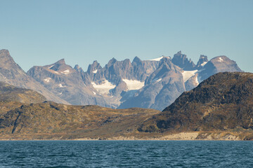 View of icebergs and mountains in the fjords of south Greenland