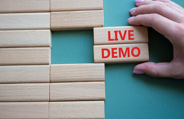 Live Demo symbol. Concept word Live Demo on wooden blocks. Beautiful grey green background....