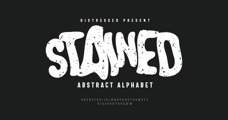 Stained Typeface: Distressed, abstract alphabet with roughened edges and vintage. A bold uppercase and number design for striking, classic visuals.