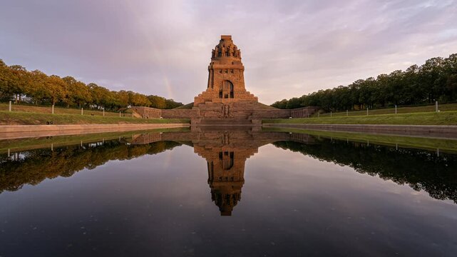 Day to night timelapse of the Monument to the Battle of the Nations (V&ouml;lkerschlachtdenkmal) in Lepizig in Germany. A rainbow is seen in the beginning