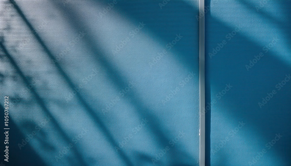 Poster abstract textured blue wall with diagonal shadows from sunlight through window, minimalist backgroun