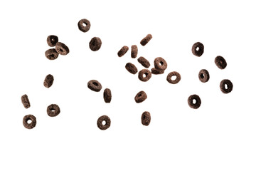 Chocolate rings cereal spill out into a bowl. Breakfast.