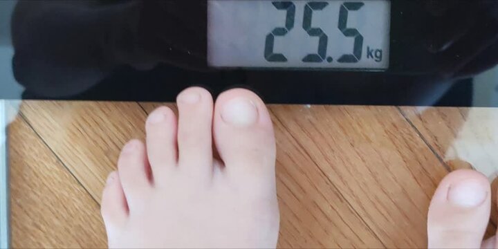 Kid on the Weighing Scale