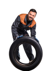 Obraz premium Mechanic holding a tire on transparent background