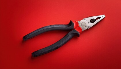 Obraz premium Handheld Pliers Tool for Versatile Mechanical, Electrical, and DIY Applications on Textured Red Background, Highlighting Durable Grip and Functional Design
