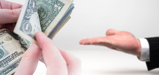 Payment for services in dollars. Money is in people hands. Man is counting USD money. Payment for...