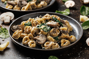 Chestnut Mushrooms and spinach tortellini served with parmesan cheese