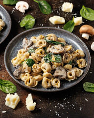 Chestnut Mushrooms and spinach tortellini served with parmesan cheese
