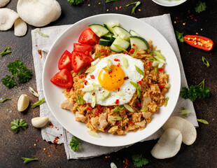 Nasi goreng, fried rice with chicken and egg in Indonesia style. Asian food