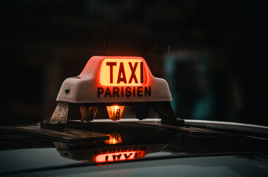 Paris, France: taxi parisien logo on a cab