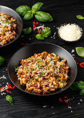 Homemade Taco Beef Pasta in a black bowl. Mexican food.