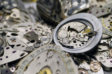 Old mechanical watches with gears and cogs. Watch or clock mechanisms