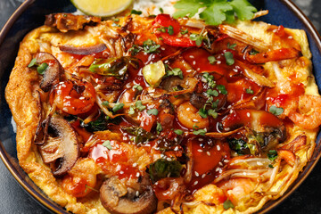 Foo Young Chinese egg omelette filled with vegetables, mushrooms, shrimp and sauce