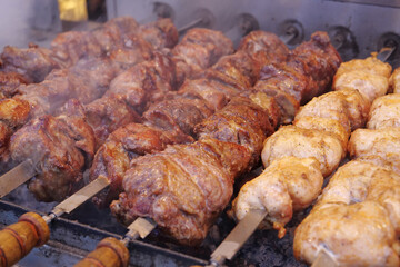 Kebabs on skewers are grilled on hot coals