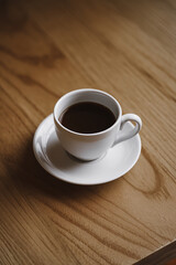 cup of coffee on wooden table