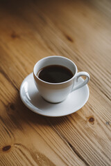 Cup of coffee on wooden table