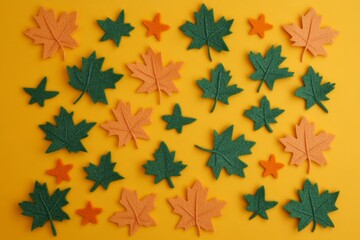 Fototapeta premium Maple leaves made of paper on a yellow background. Greeting card concept, autumn season. Top view, flat styling, copy space
