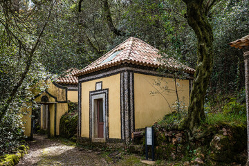 Calvary chapel in the way to the cross, via crucis, trail on ancient forest of Bussaco, in Luso,...
