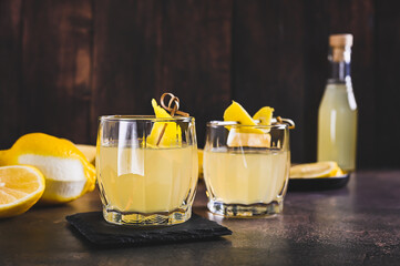 Traditional homemade limoncello in glasses on the table
