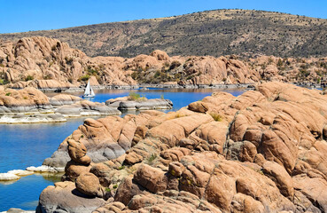 Sailboats on the waters of Watson Lake surrounded by the boulders of Granite Dells - Prescott, AZ.