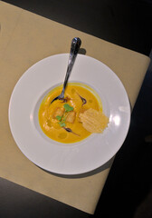 Top View of Gourmet Pumpkin Soup in Elegant Setting
