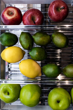 Fresh fruits organized in a modern refrigerator