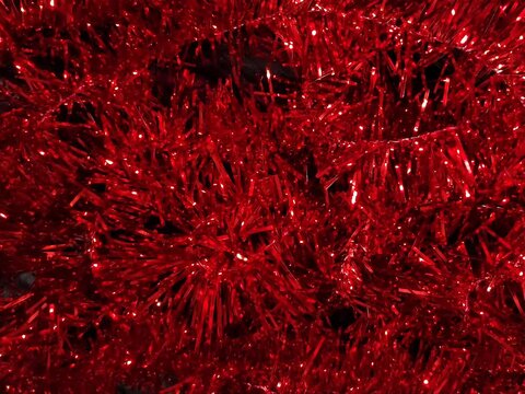 red christmas tinsel abstract background