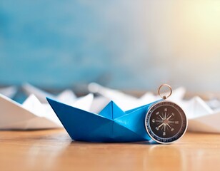 blue paper boat leading a fleet of small white boats with compass icon on wooden table with sunlight leadership concept