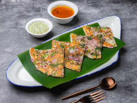 Indian food slice on green banana leaf