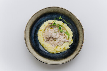 Creamy mashed potatoes with meat stew, a comforting dish perfect for hearty meals and cozy dinners
