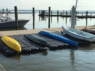 Canoes and boats on the harbor of Cape Cod