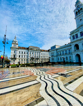 Arad City Hall, Romania, with garden on a blue sky day.