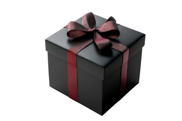 Obraz premium A beautifully wrapped black gift box adorned with a festive red ribbon and bow, set against a white background.