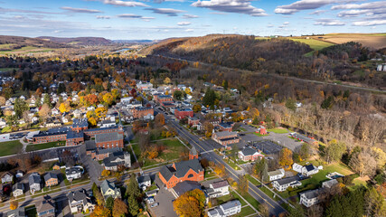 Aerial photo of fall foliage surrounding the Village of Homer, Cortland County, New York State, October 2024.	