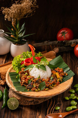 Spicy sambal with anchovies and petai, served with fragrant rice – a burst of flavor in every bite