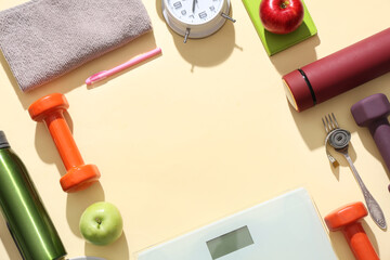 Frame made of scales with bottles of water, dumbbells and apples on beige background. Weight loss...