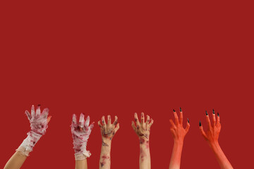 Mummy, zombie and devil hands on red background. Halloween celebration