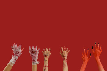 Mummy, zombie and devil hands on red background. Halloween celebration