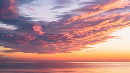 Fototapeta premium Sunset Sky with Streaky Clouds Over Calm Sea