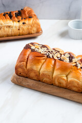 croissant with chocolate filling and almonds on top. perfect for recipe, article, catalogue, or any commercial purposes. with copy space.