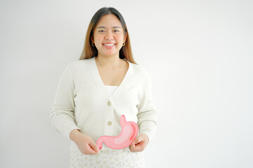 Asian woman hands holding stomach, heartburn, Gastroesophageal reflux disease (GERD) or acid reflux...