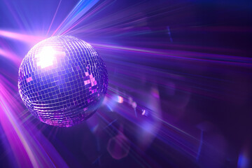 Photo of a disco ball with light beams on a dark purple background, representing the fun and excitement of nightlife for a party banner or flyer design.