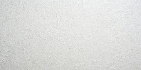 A close-up of a smooth, off-white surface with an uneven, textured finish, reminiscent of freshly fallen snow.