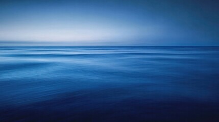 Fototapeta premium A serene landscape of the deep blue sea at twilight,