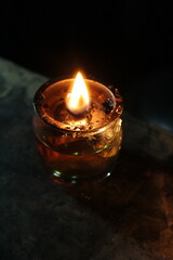 A candlelight shine in the dark