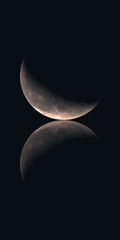 Waning Crescent Moon on Black Background with Reflection