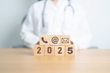 Contact Us concepts. Happy New Year 2025 with Wood block of Email, call Phone and Website Address...