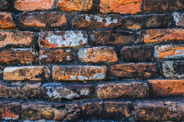 Ancient old orange brick brick wall close-up