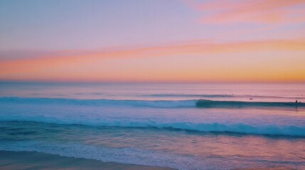 Obraz premium gentle blue ocean waves lapping against a sandy shore, with the sunlight reflecting off the water's surface, creating a shimmering effect.